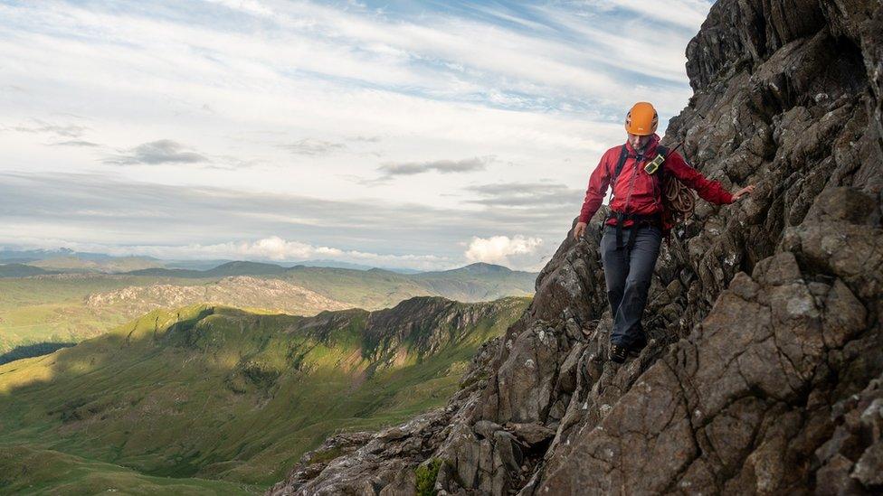 Llanberis Mountain Rescue Team member descending Crib Goch following a rescue