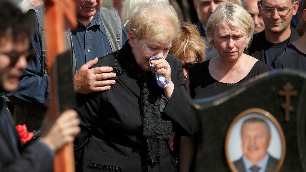 Mother of killed journalist Pavel Sheremet and his partner Olena Prytula, right, cry during his funeral at a cemetery in Minsk, Belarus, Saturday,23 July 2016.