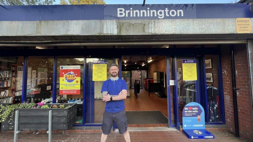 Stewart Hall standing in front of Brinnington station