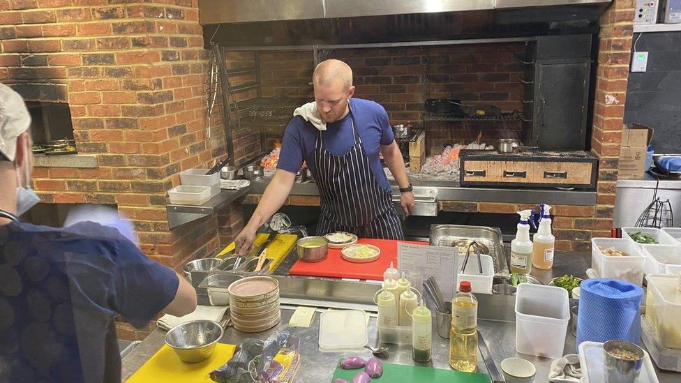 Head chef at the Due South restaurant at work in his kitchen