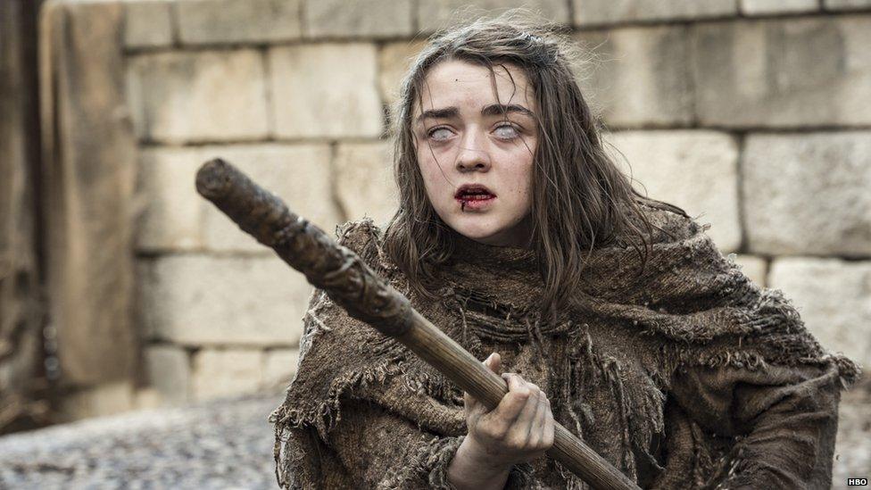 Arya Stark with a stick