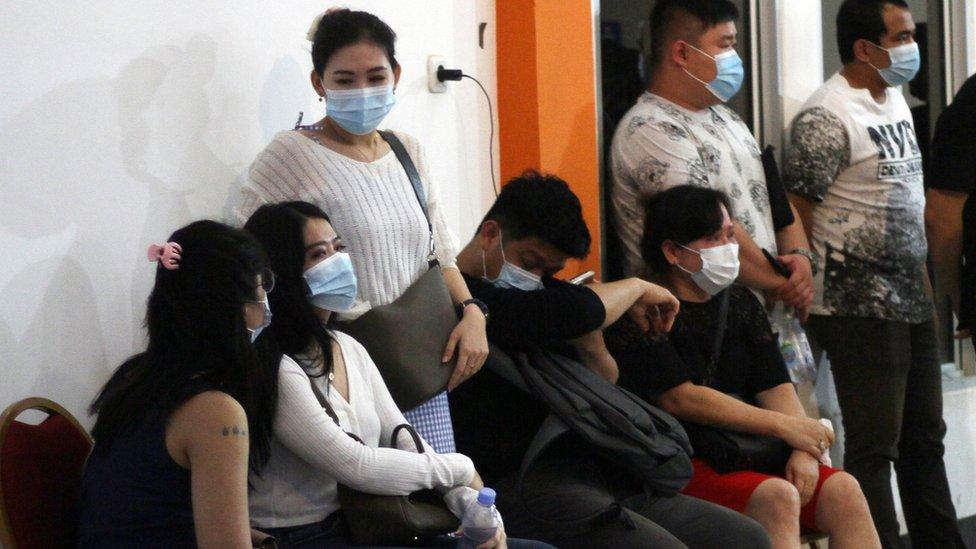 Family members of Sriwijaya Air plane passengers wait for news at Pontianak airport, Indonesia 9 January 2021