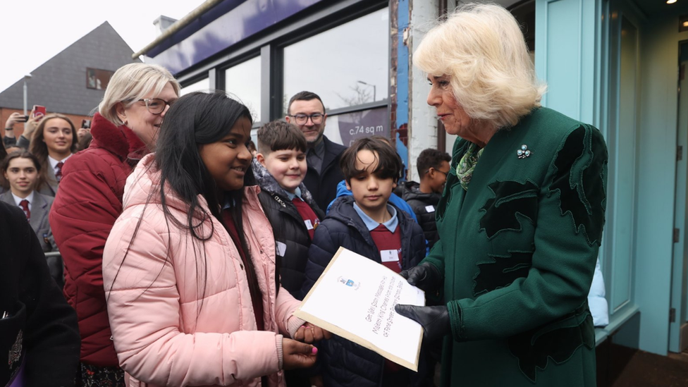 The Queen was presented with a card by pupils from Fane Street Primary School