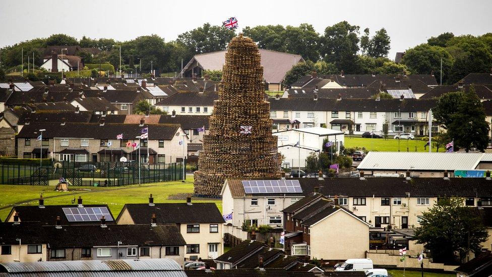 A bonfire towers over houses in the Craigyhill estate in Larne