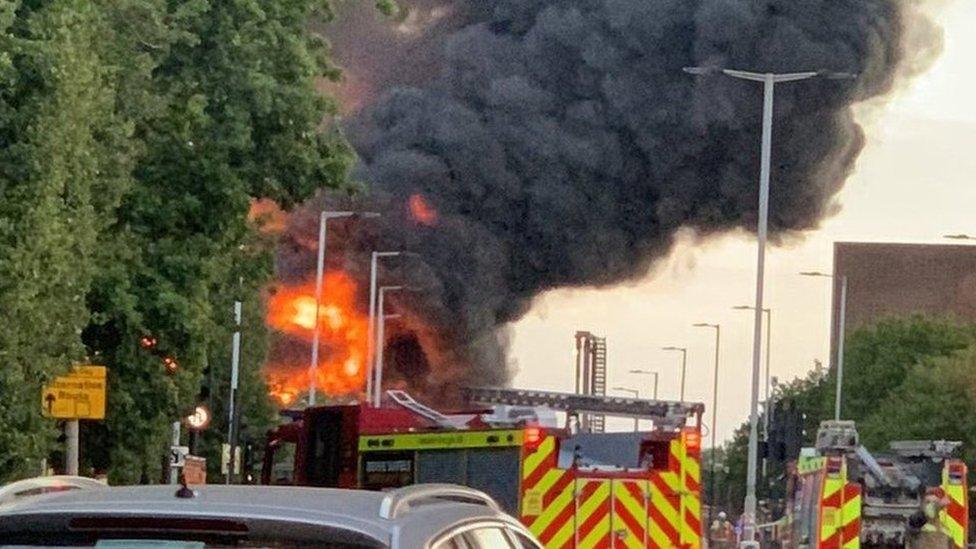 The blaze has created a huge plume of black smoke