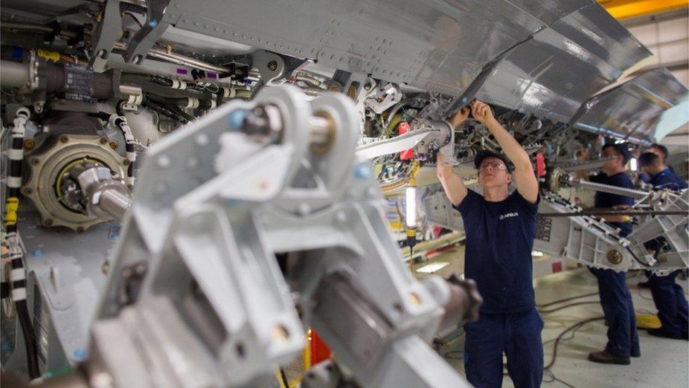 Fitters work on the spoiler of a A400M at the Filton site