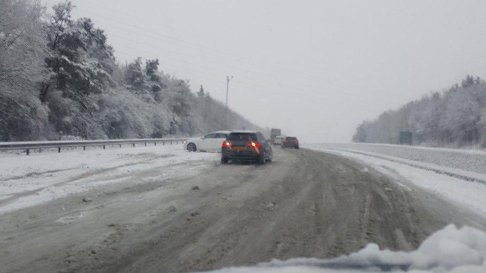 cars on the motorway in the snow