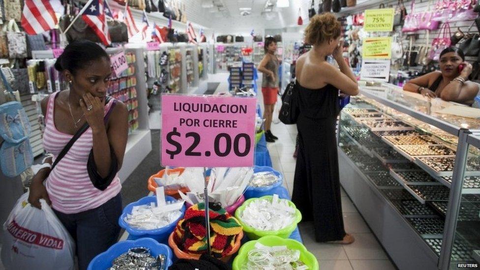 People shop in a store in San Juan, Puerto Rico (03 August 2015)