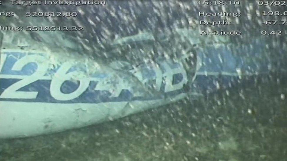 The rear left side of the plane fuselage on the seabed