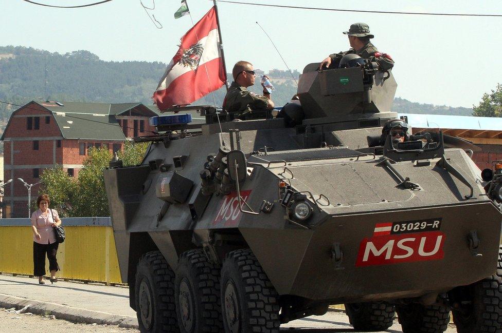 Austrian APC on patrol in Kosovo, Sept 2012 file pic