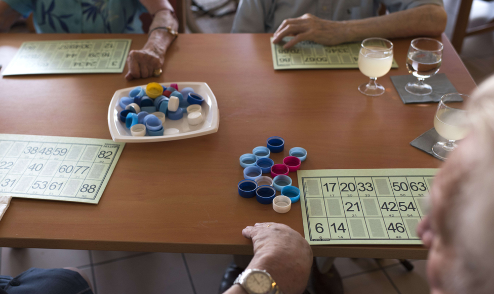 A file photo of elderly people in a care home playing Lotto