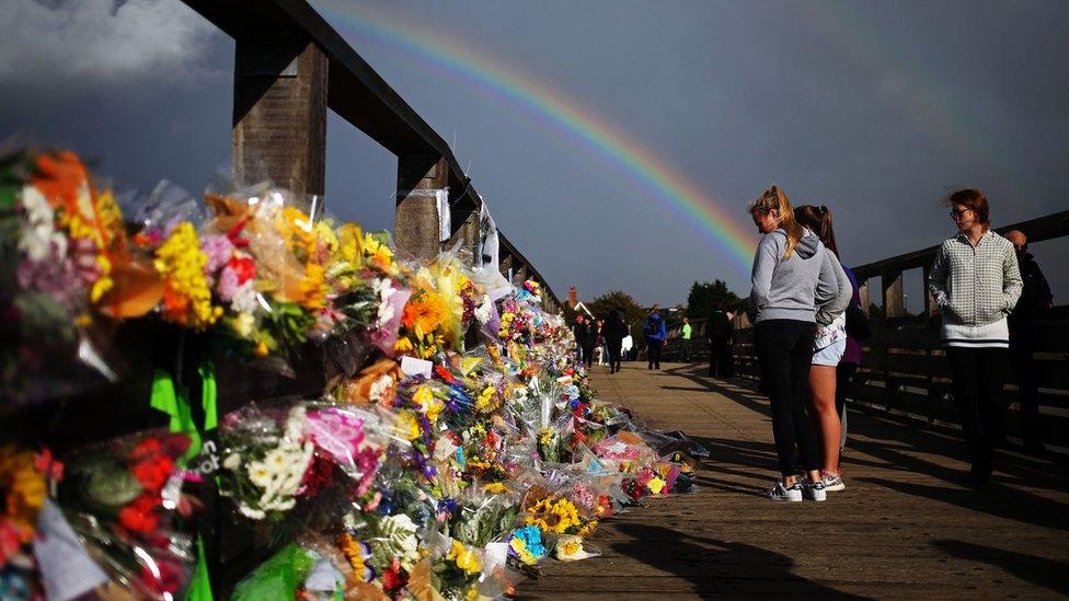 Floral tributes on a bridge near the A27