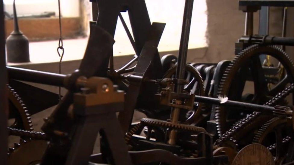 The workings of the clock, which was added to the Norman tower