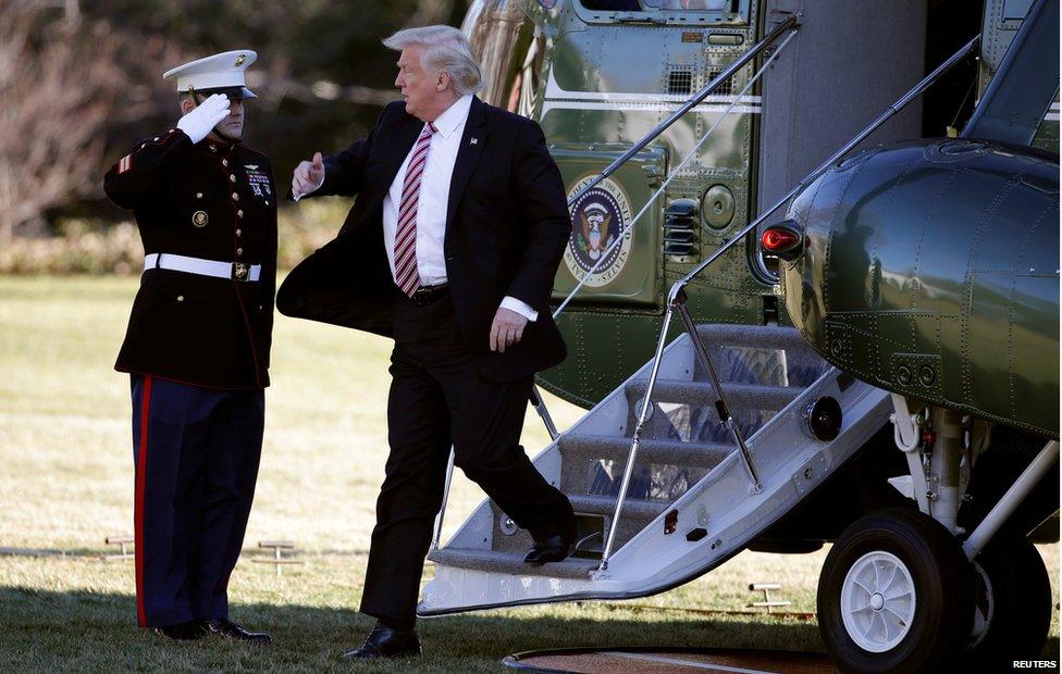 Donald Trump exiting a helicopter down some stairs