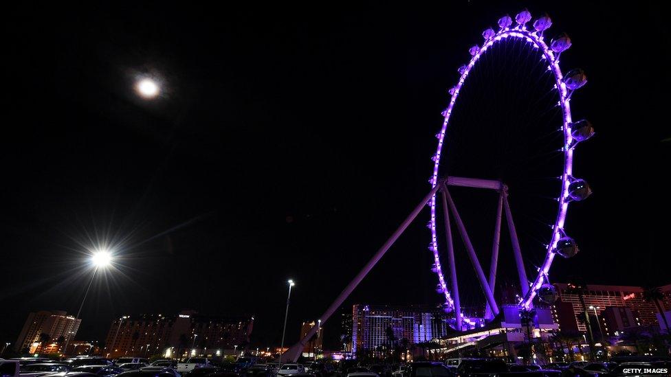 The High Roller at The LINQ Promenade on the Las Vegas Strip is lit up purple