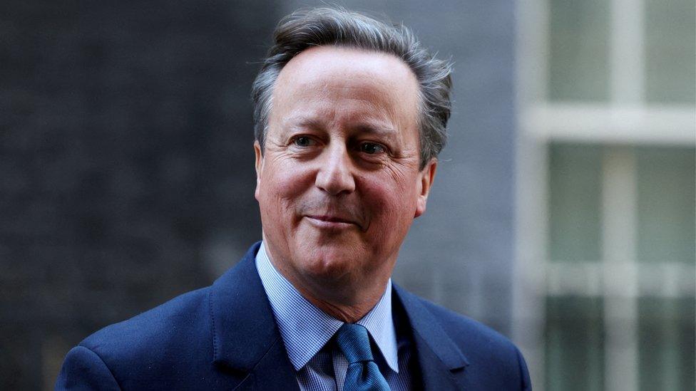 Britain's former Prime Minister and newly appointed Foreign Secretary David Cameron walks outside 10 Downing Street