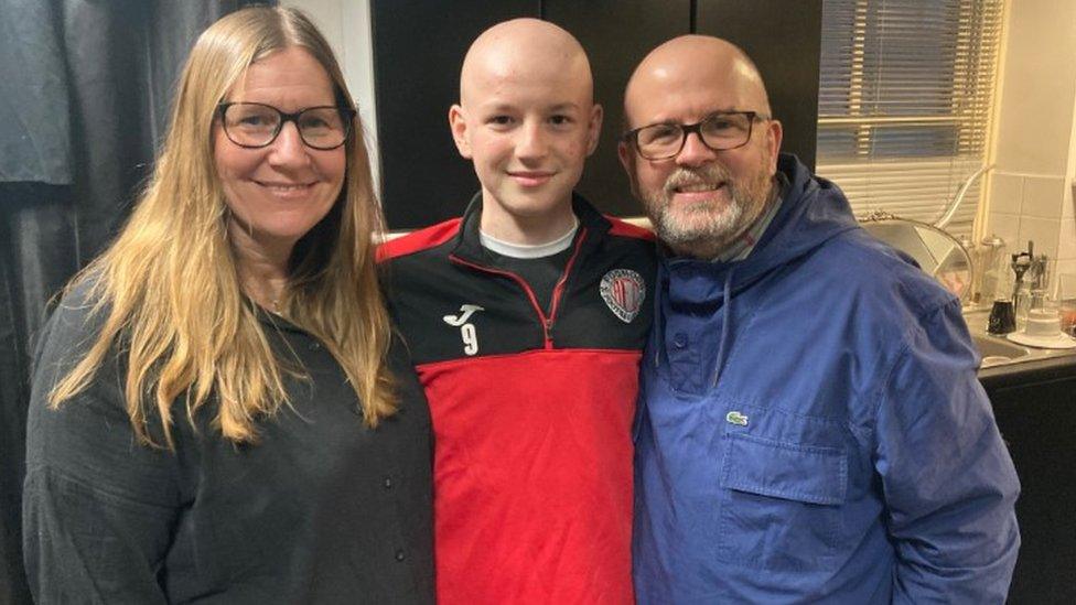 Owen with his parents Andrea and Bill