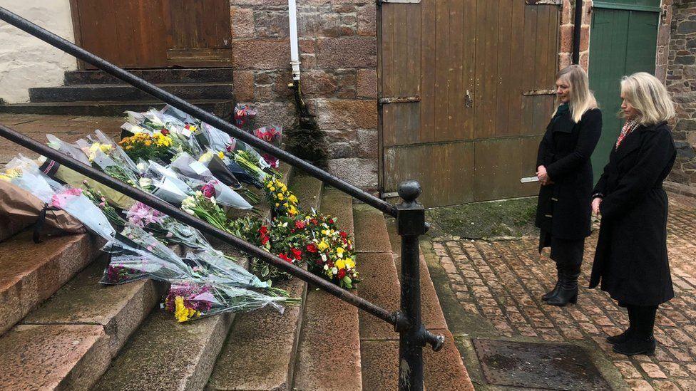 Floral tributes on steps