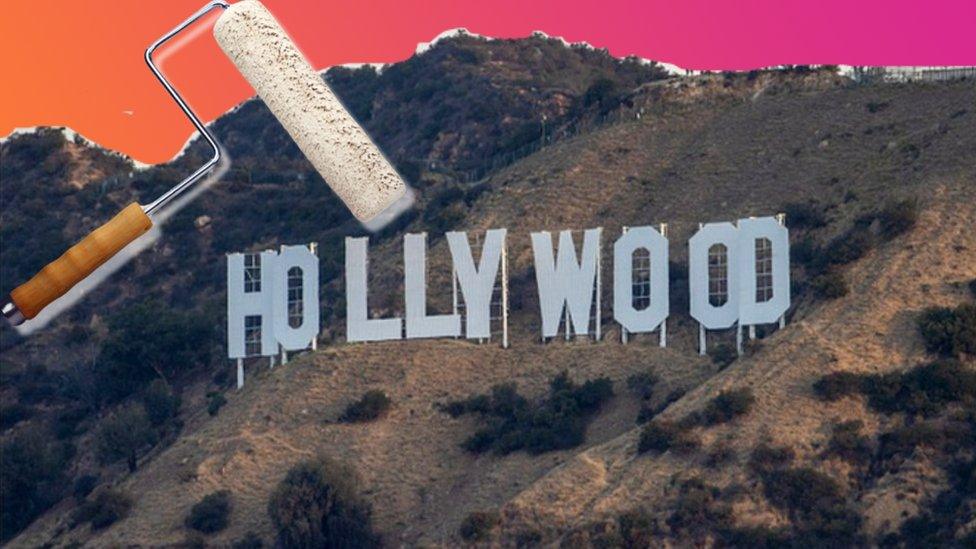 hollywood sign with white paint roller