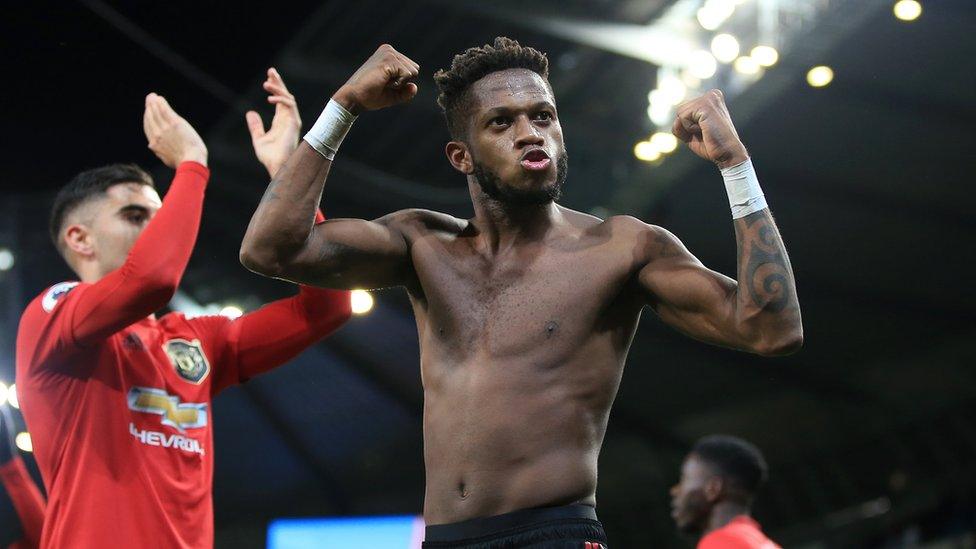 Fred celebrates with players