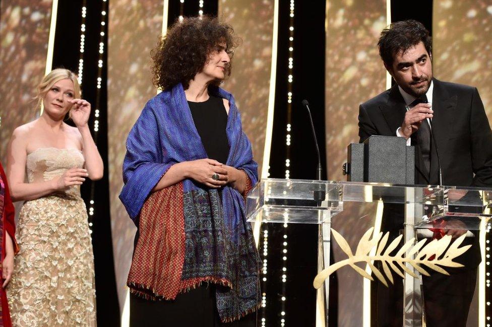 Shahab Hosseini accepts the Best Actor prize for the movie 'The Salesman' at the closing ceremony of the annual 69th Cannes Film Festival on May 22, 2016