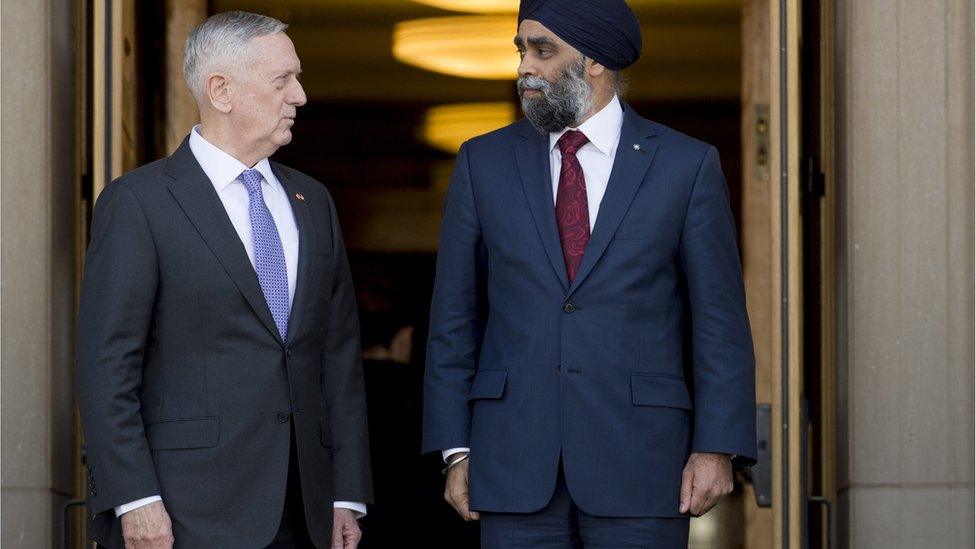 US Secretary of Defense James Mattis (L) and Canadian Minister of Defense Harjit Sajjan speak prior to a meeting at the Pentagon in Washington, DC, February 6, 2017.