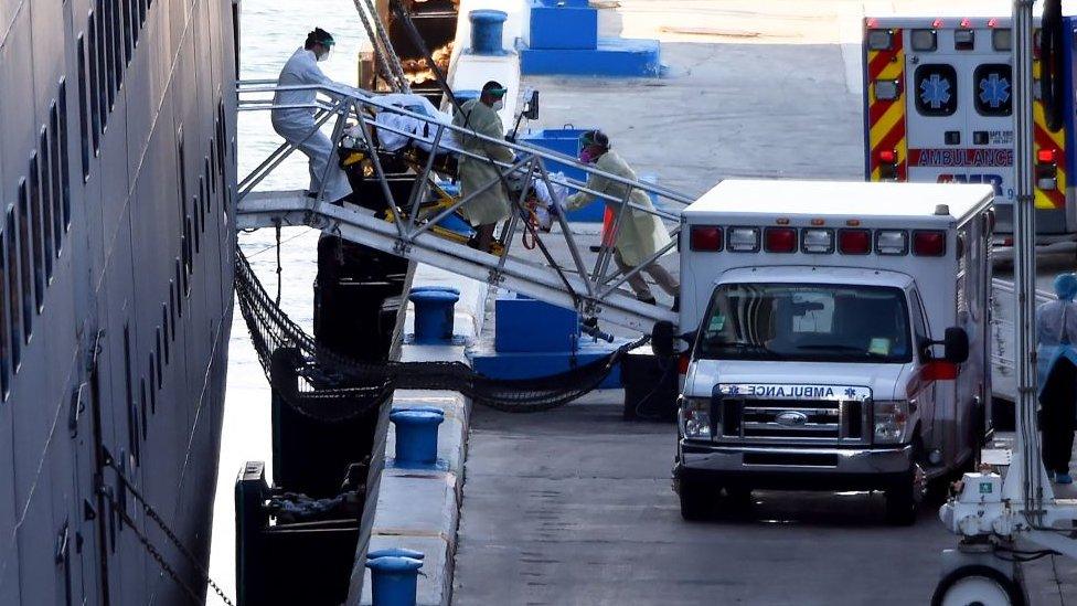 A passenger being taken on a stretcher from the Zaandam cruise ship in Fort Lauderdale