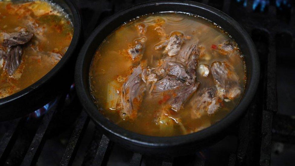 Bowls of dog meat soup at a restaurant in Daegu, 10 January 2024