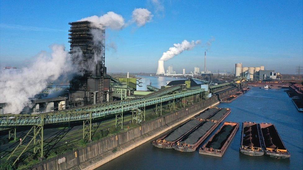 In this aerial view barges arrive with coking coal at the Thyssenkrupp Steel Europe steelworks in Duisburg, Germany, 9 November 2021