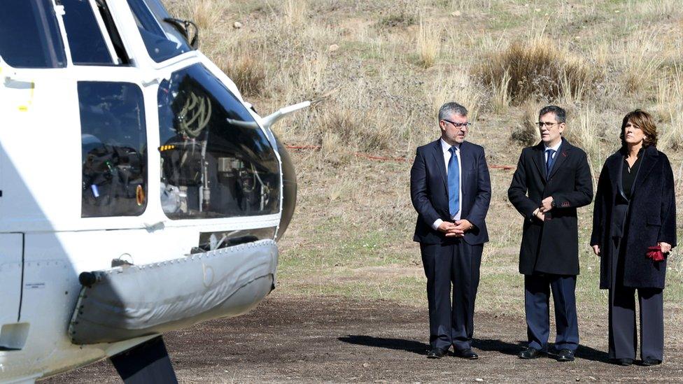 Secretary of State Communication Miguel Ãngel Oliver (L), General Secretary of the Prime Minister"s office Felix Bolanos (C) and Caretaker Justice Minister Dolores Delgado watch as the coffin of Francisco Franco arrives at the Mingorrubio El Pardo cemetery