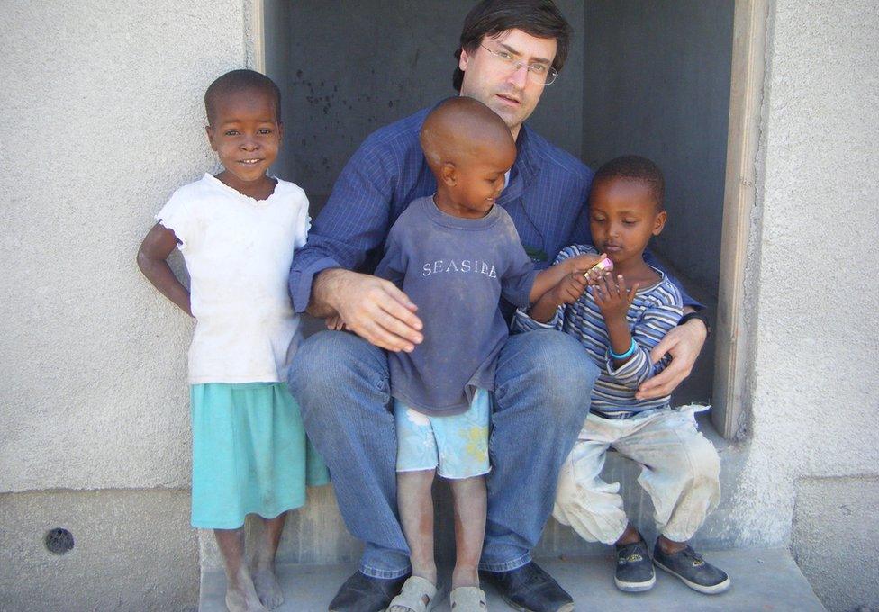 Dr Bartolo with some African children