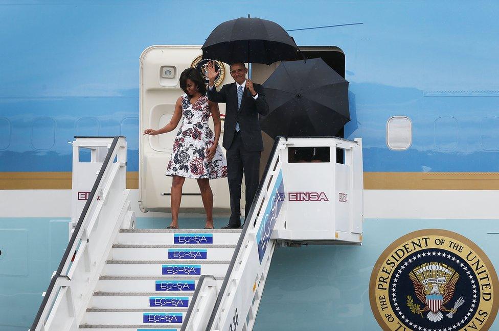 US President Barack Obama and his wife Michelle exit Air Force One