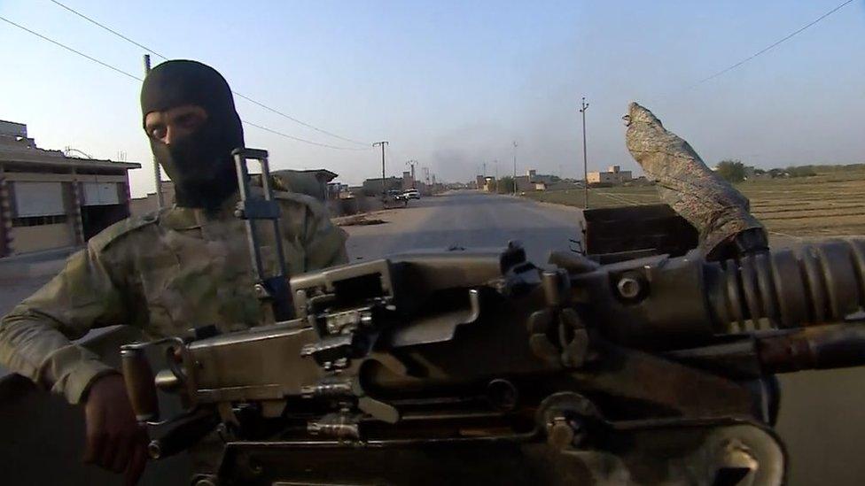 An Iraqi Shia militia fighter in Albu Kamal, Syria