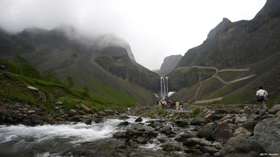 A view of a waterfall and river in the Changbai mountains