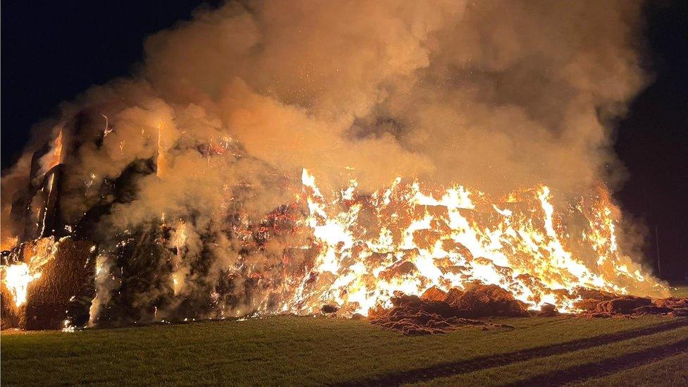 Straw stack on fire