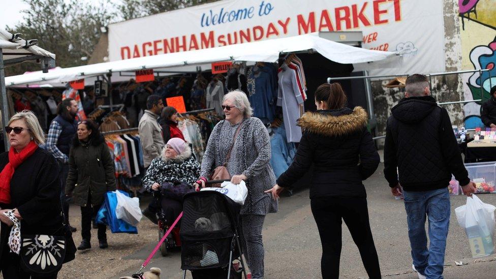 People shop at Dagenham Sunday Market