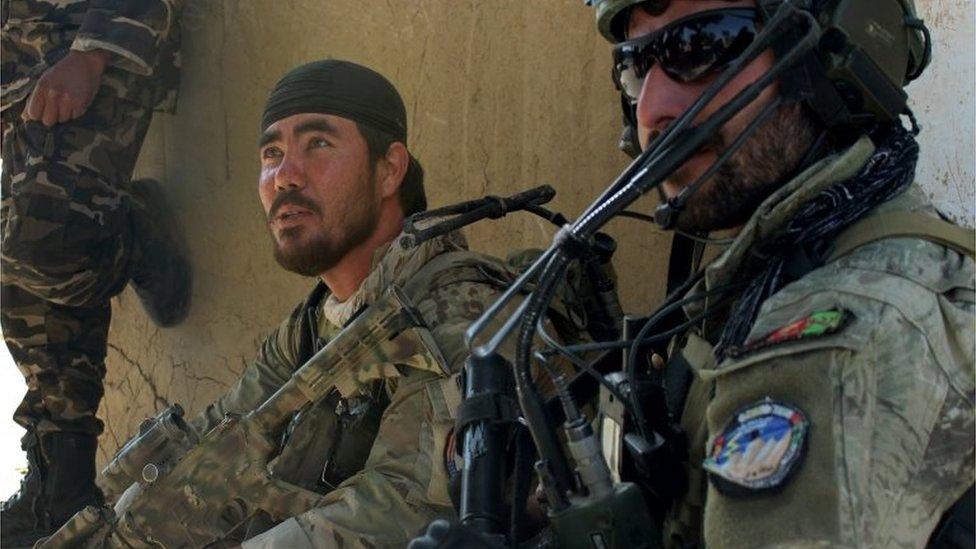 Afghan National Army commandos look on amid ongoing fighting between Taliban militants and Afghan security forces in Kunduz on October 4, 2016.