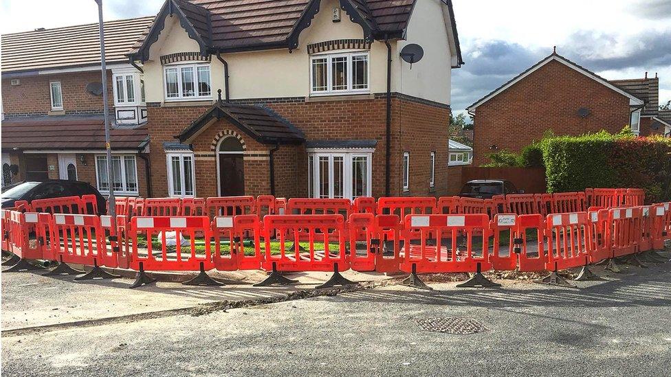 Home surrounded by barriers