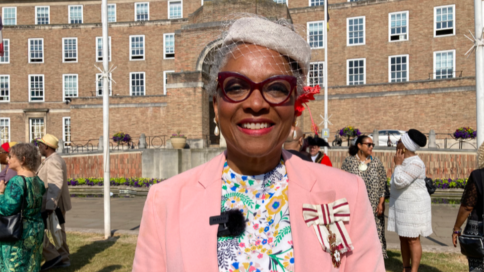 Peaches Golding standing in front of City Hall