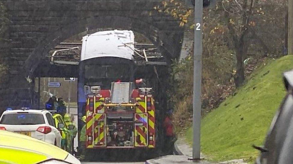 The bus hit the bridge in Swansea on Thursday