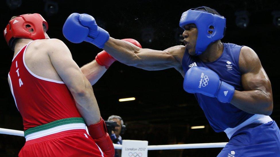 Anthony Joshua (in blue) fights for gold in the Men's Super-heavyweight boxing at the London 2012 Olympic Games