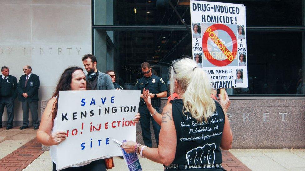 A woman protesting safe injection sites in Philadelphia