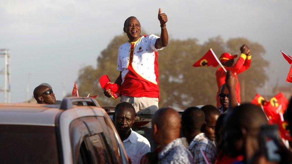 President Uhuru Kenyatta gestures to supporters as he leaves the last Jubilee Party campaign rally ahead of the August 8th election in Nakuru, Kenya