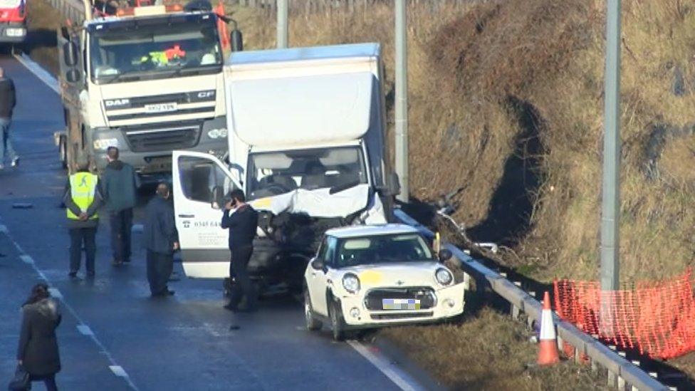 A dented van and car