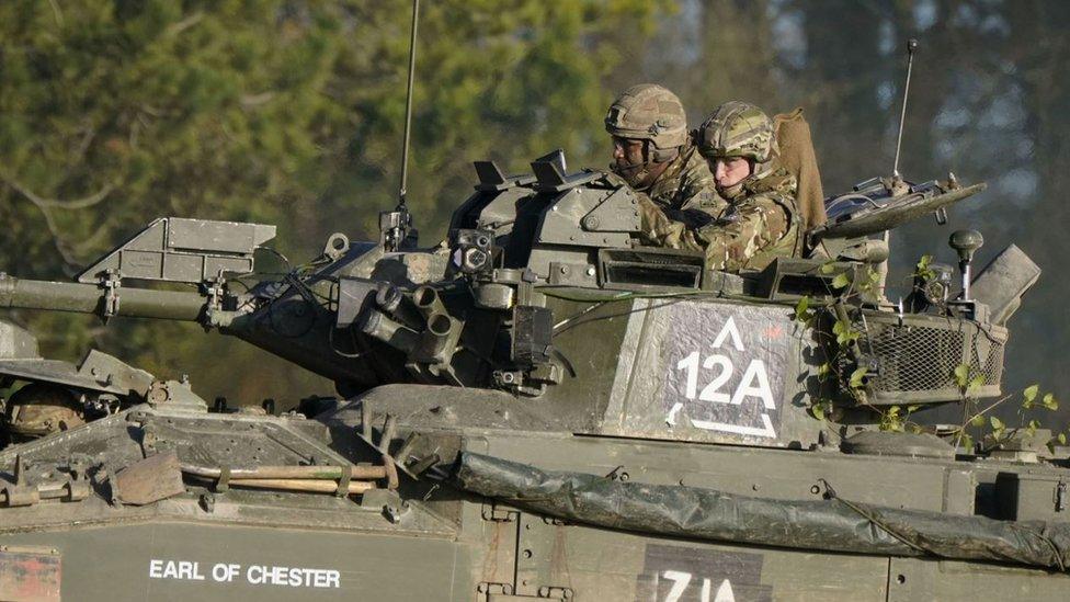 The Prince of Wales, Colonel-in-Chief, 1st Battalion Mercian Regiment (right), rides in an armoured vehicle while on a training exercise during a visit to the regiment, in the south west of the UK, for the first time following his appointment to the role by King Charles III.