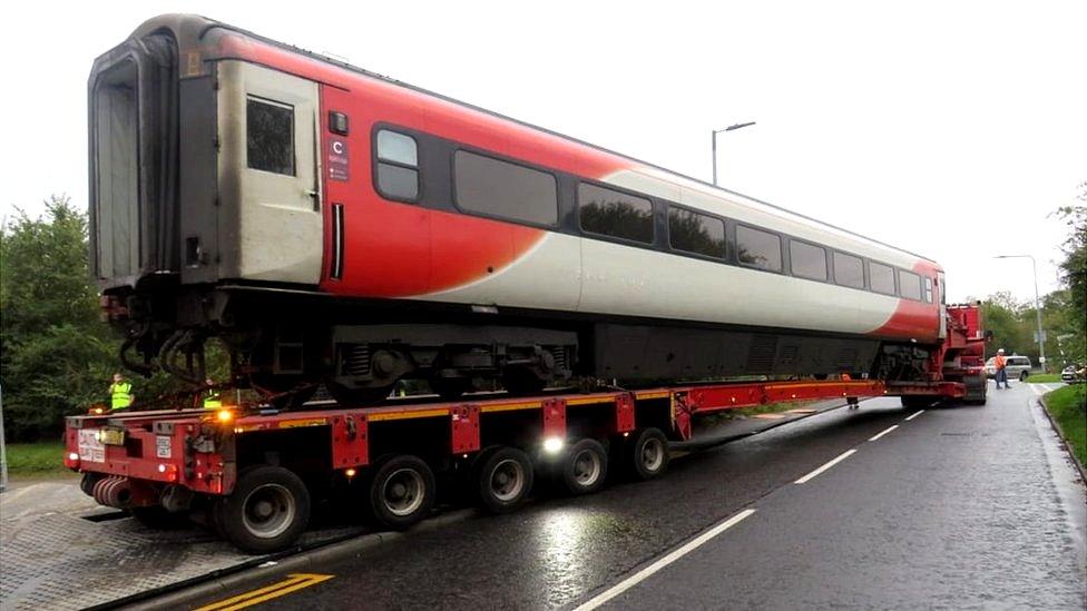 Train carriage on transporter