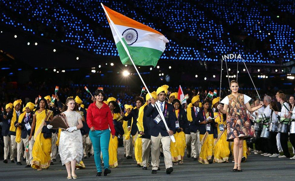 Sushil Kumar of the India Olympic wrestling team carries his country's flag during the Opening Ceremony of the London 2012 Olympic Games at the Olympic Stadium on July 27, 2012 in London, England.