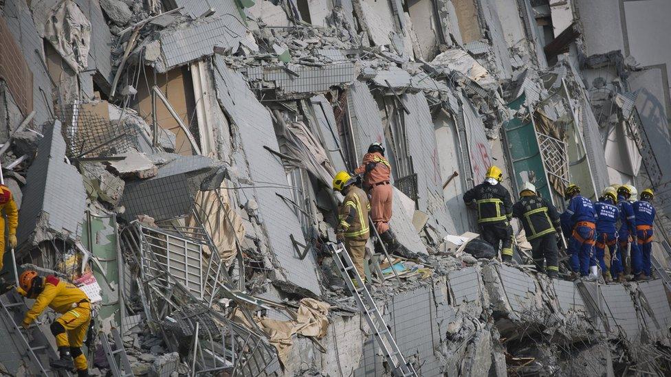 Rescuers search the collapsed building in Tainan, Taiwan, on 6 February 2016