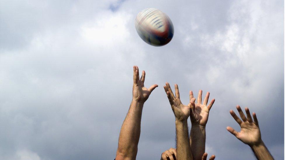 Rugby Players Fighting for the Ball - stock photo