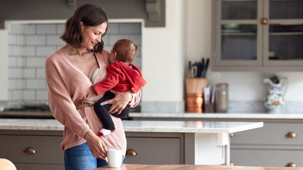 Woman wearing a cordless breast pump